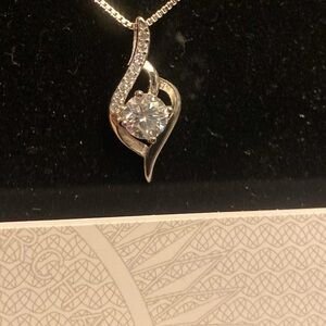 Elegant Silver Necklace with Spiral Design and Sparkling Centerpiece